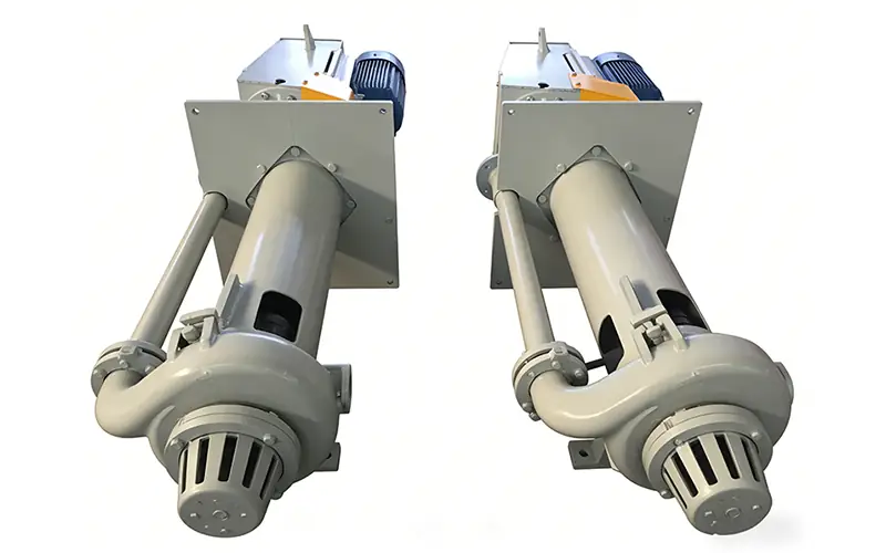 Two light gray vertical slurry pumps with top-mounted motors, shown against white background.