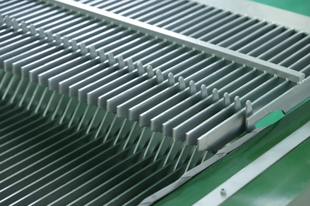 Close-up detail of stainless steel fine bar screen grid bars and rake teeth mechanism