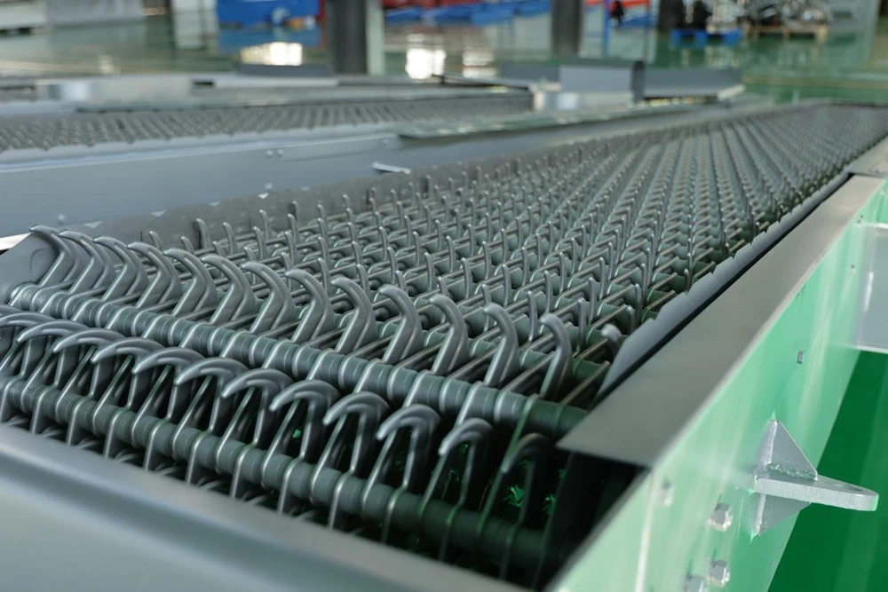 Close-up of modular rake teeth on a mechanically cleaned bar screen