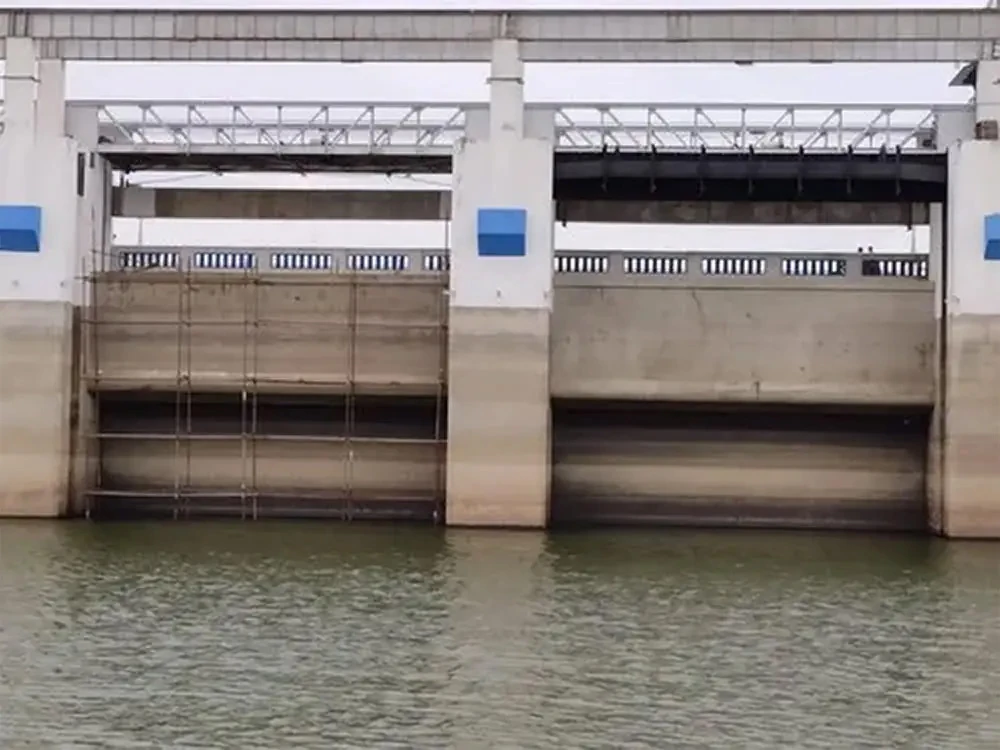 sluice gate structure in a municipal wastewater channel used for water flow control and section isolation