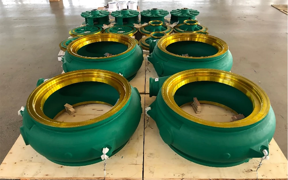 Heavy-duty green slurry pump volute casings with machined yellow flanges ready for delivery