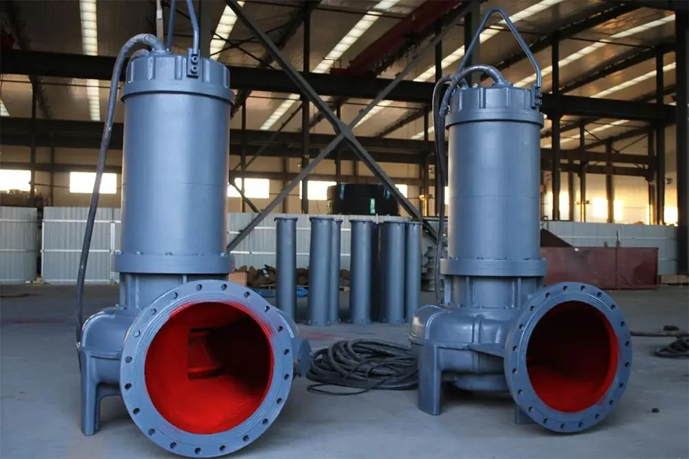 Large-passage submersible sewage pumps with red interior coating in a pump manufacturing facility