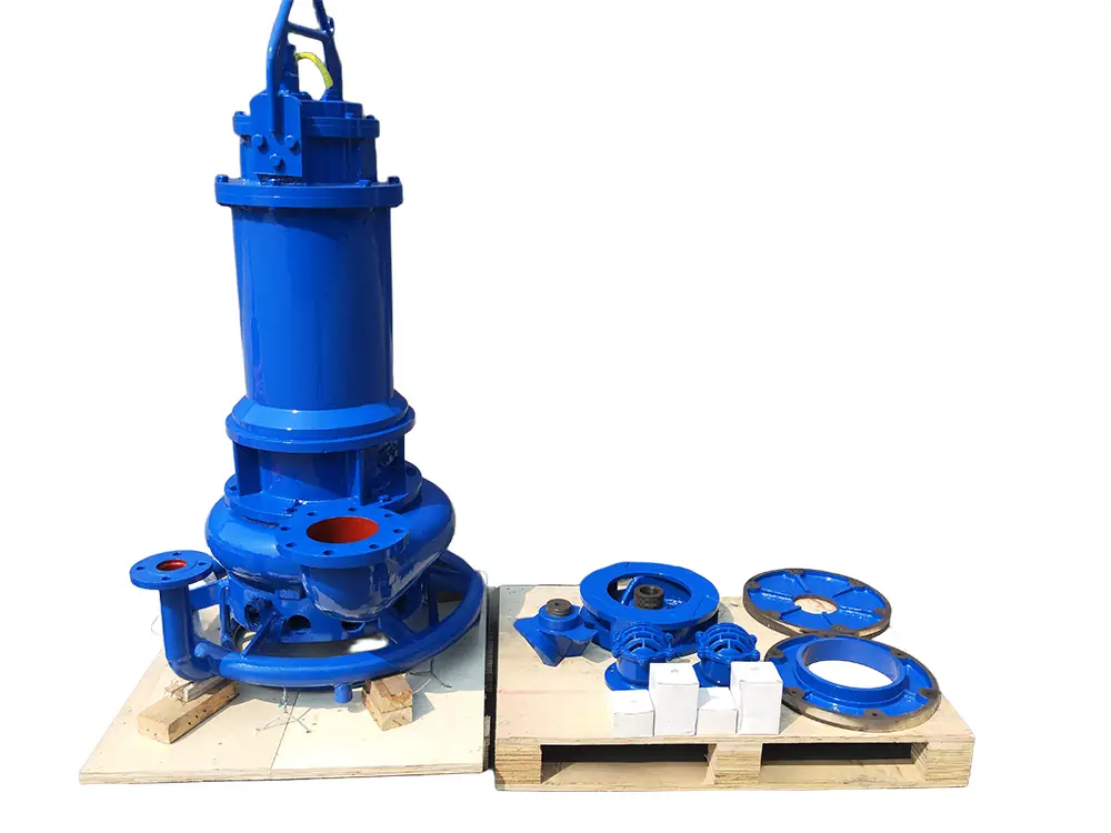 A blue heavy-duty submersible slurry pump displayed on wooden pallets along with its disassembled spare parts.