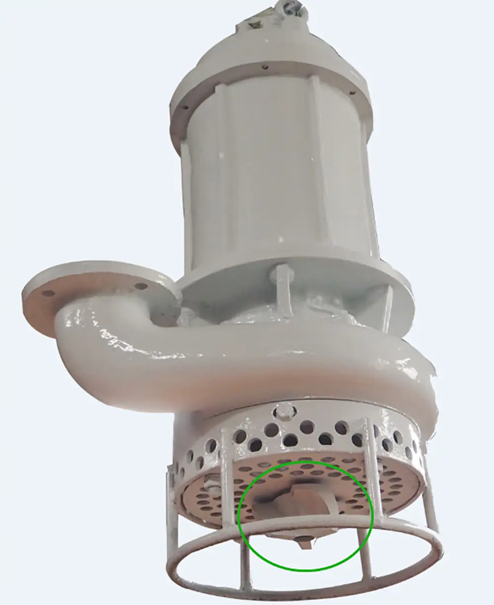 Heavy-duty submersible sewage cutter pump with a highlighted anti-clogging agitator blade at the base.