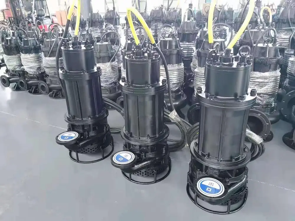 industrial heavy duty black submersible slurry pumps lined up in a workshop.